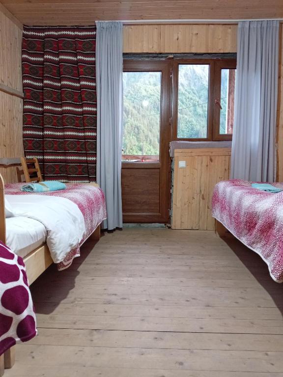 Postel nebo postele na pokoji v ubytování Stone House marexi