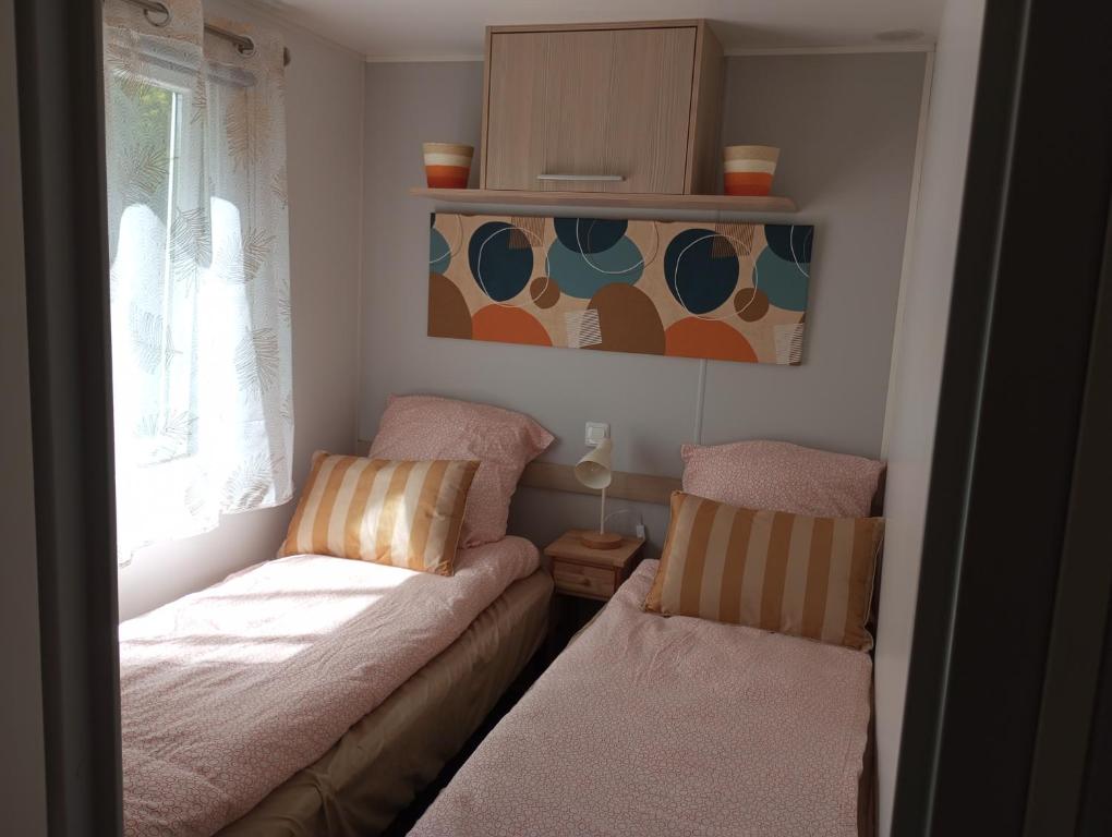 Postel nebo postele na pokoji v ubytování L insolite du chalet