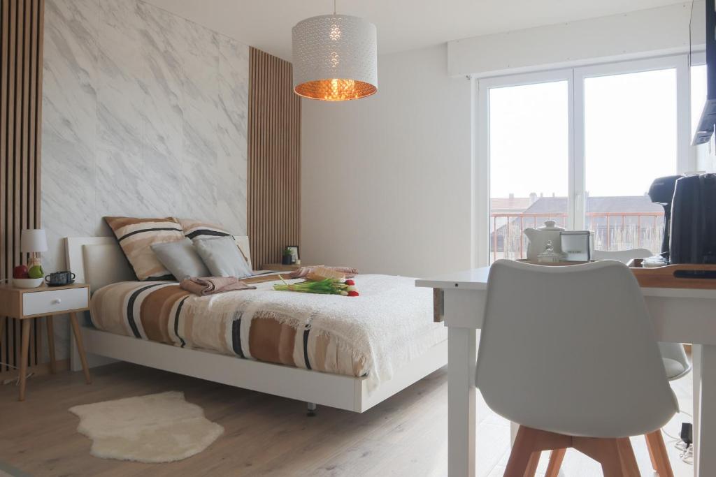 Photo de la galerie de l'établissement Studio cosy Les Eaux Vives, à Huningue