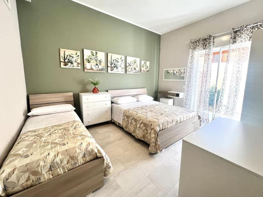 Postel nebo postele na pokoji v ubytování Casa Maria - Proppro SRL - Vicino Milazzo