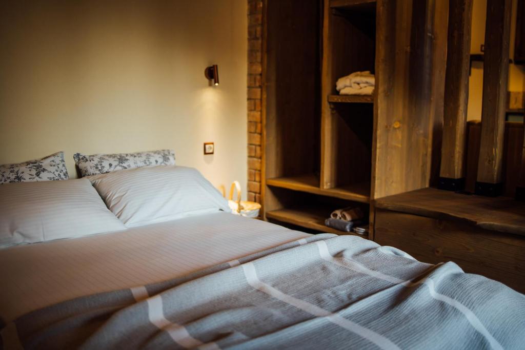 Postel nebo postele na pokoji v ubytování Karaiskos Agritourism Farm