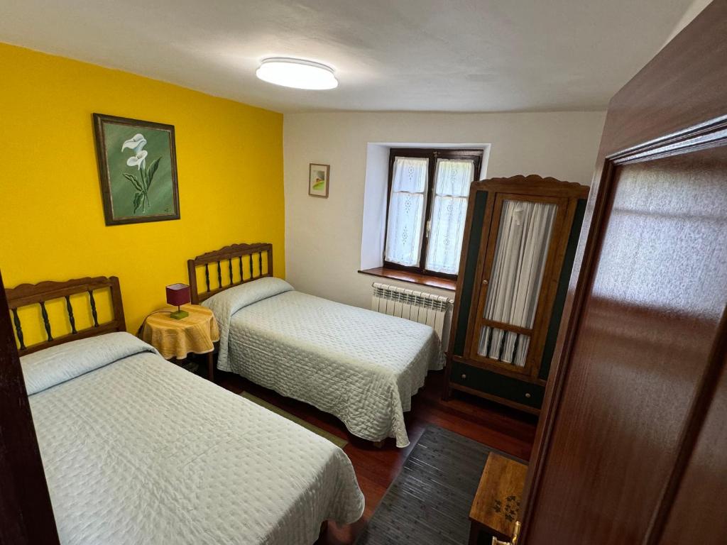 Postel nebo postele na pokoji v ubytování Casuca de Susi