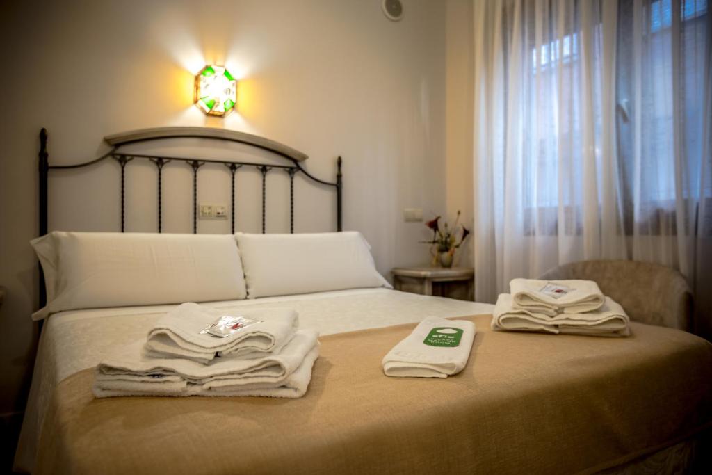 Postel nebo postele na pokoji v ubytování Hostal Tic-Tac