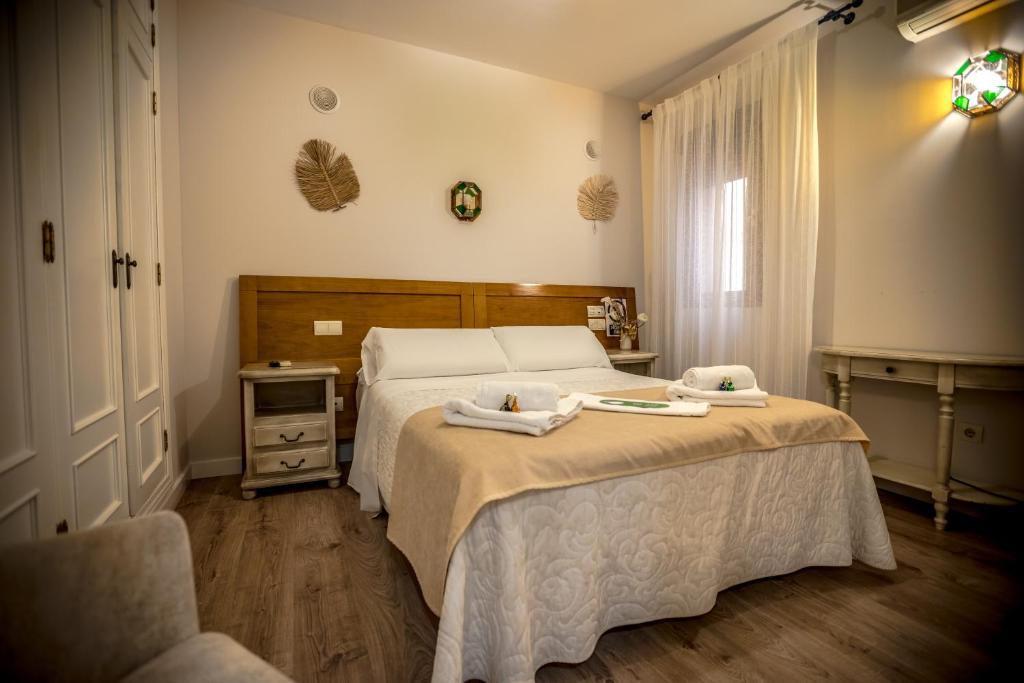 Postel nebo postele na pokoji v ubytování Hostal Tic-Tac