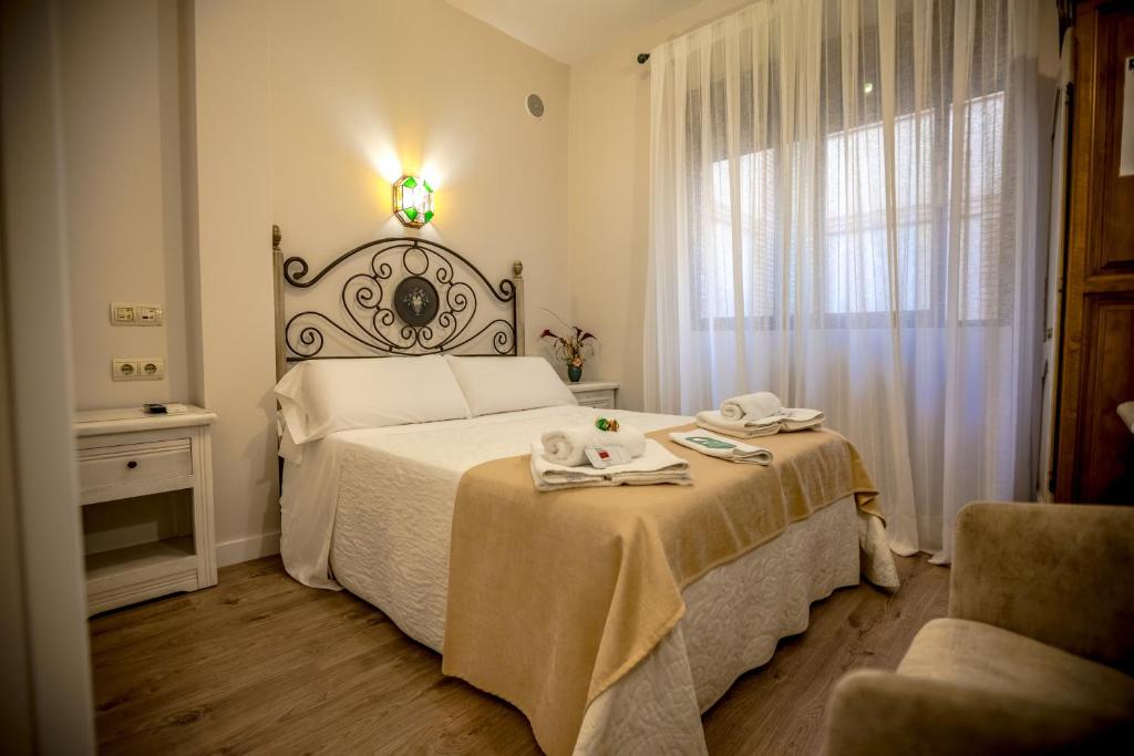 Postel nebo postele na pokoji v ubytování Hostal Tic-Tac