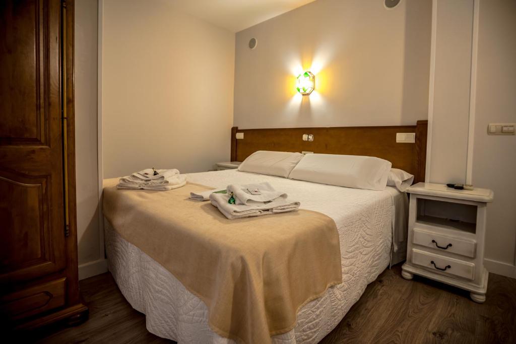 Postel nebo postele na pokoji v ubytování Hostal Tic-Tac