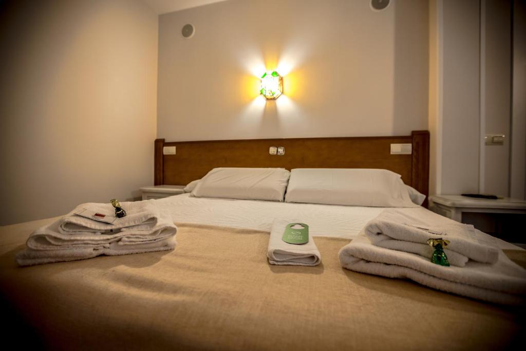 Postel nebo postele na pokoji v ubytování Hostal Tic-Tac