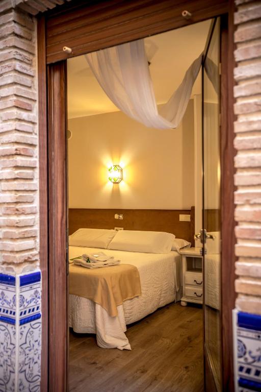 Postel nebo postele na pokoji v ubytování Hostal Tic-Tac