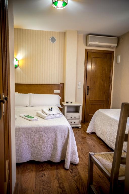 Postel nebo postele na pokoji v ubytování Hostal Tic-Tac