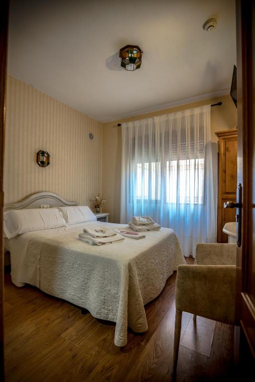 Postel nebo postele na pokoji v ubytování Hostal Tic-Tac