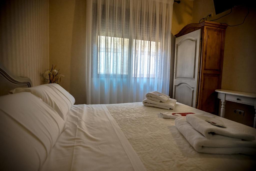 Postel nebo postele na pokoji v ubytování Hostal Tic-Tac