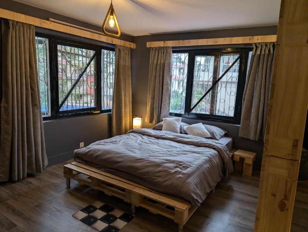 En eller flere senge i et værelse på Escape stay