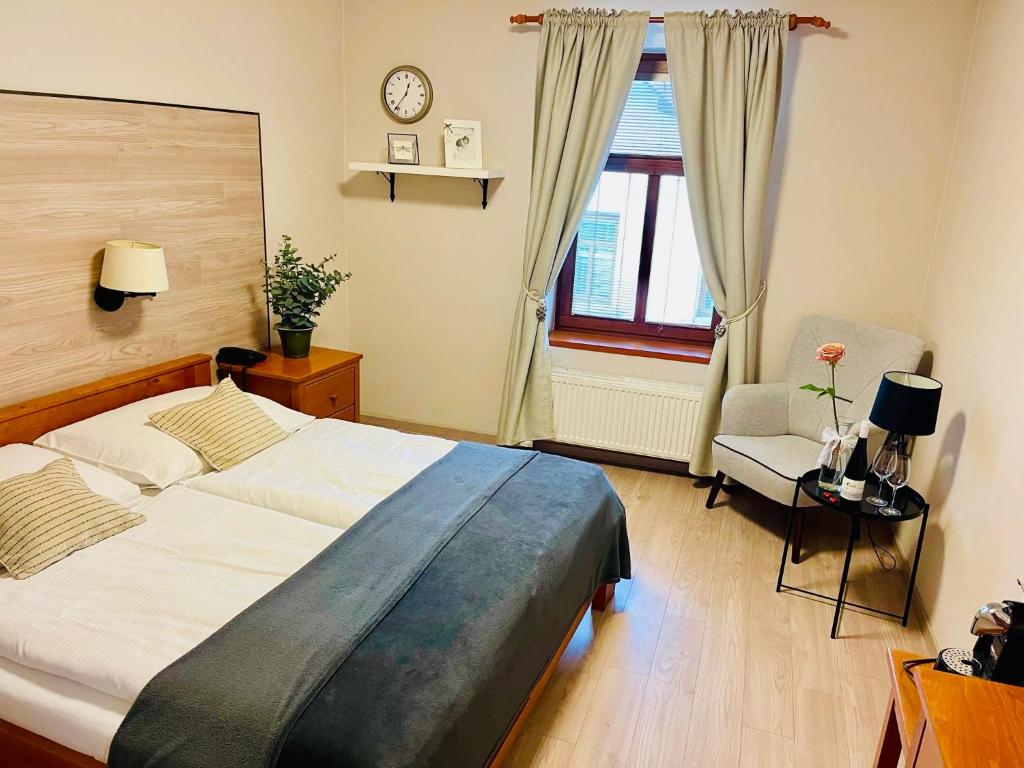 Postel nebo postele na pokoji v ubytování Hotel Pošta
