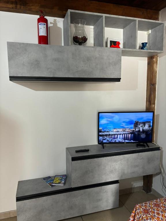 A television and/or entertainment centre at Azzurra Apartment