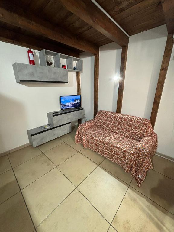 A bed or beds in a room at Azzurra Apartment