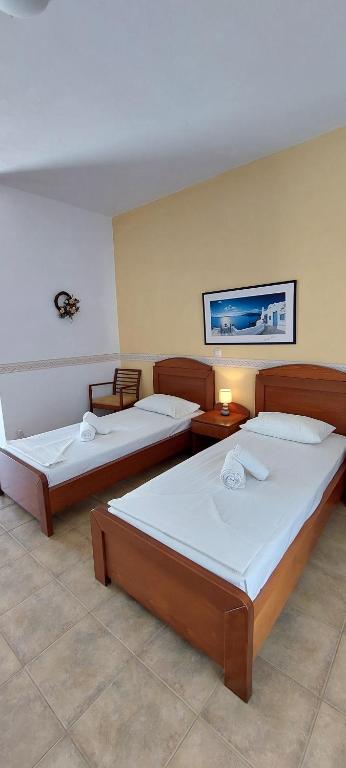 Postel nebo postele na pokoji v ubytování Aegean Star Hotel