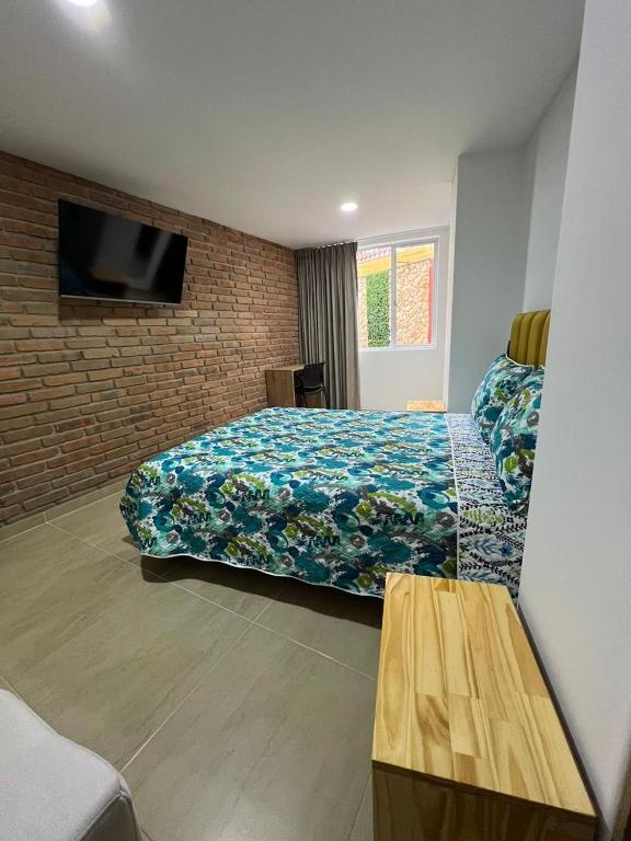 Postel nebo postele na pokoji v ubytování BISÁU Hotel