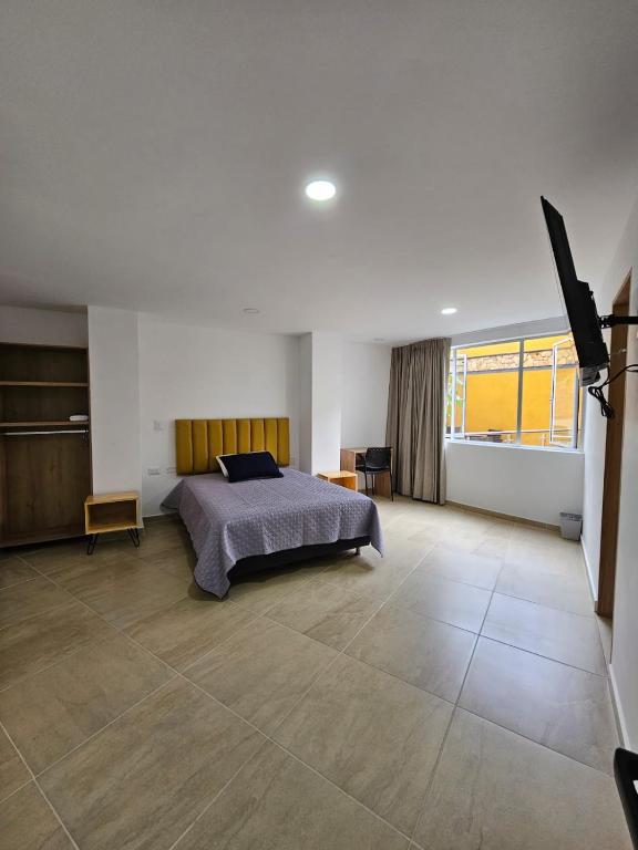 Postel nebo postele na pokoji v ubytování BISÁU Hotel