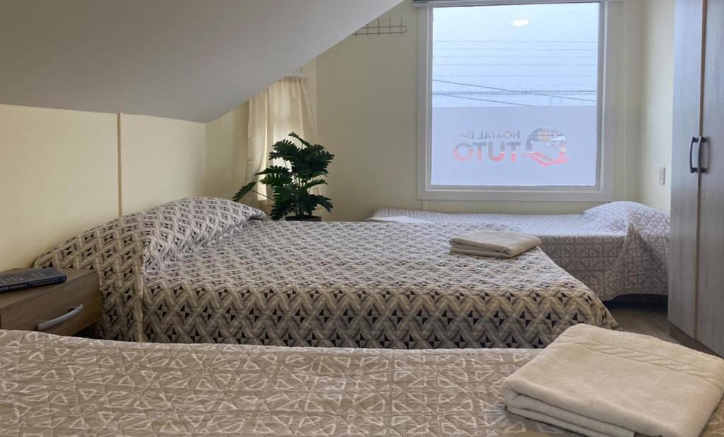 Postel nebo postele na pokoji v ubytování Hostal Del Tuto
