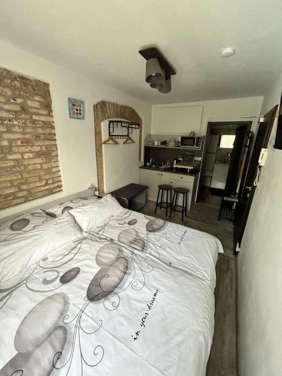 Postel nebo postele na pokoji v ubytování Apartmány u Kuželky
