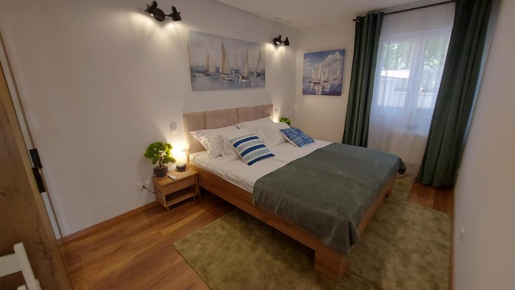 Postel nebo postele na pokoji v ubytování Stellaris Apartmani