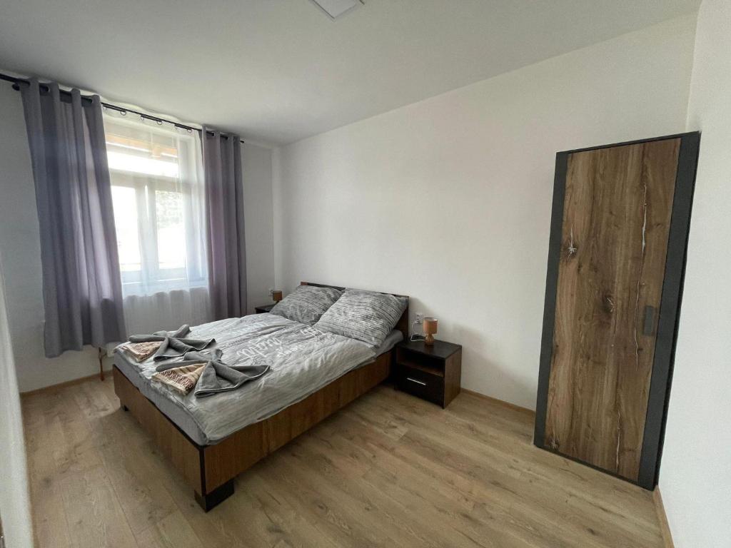 Postel nebo postele na pokoji v ubytování Apartmány Sport