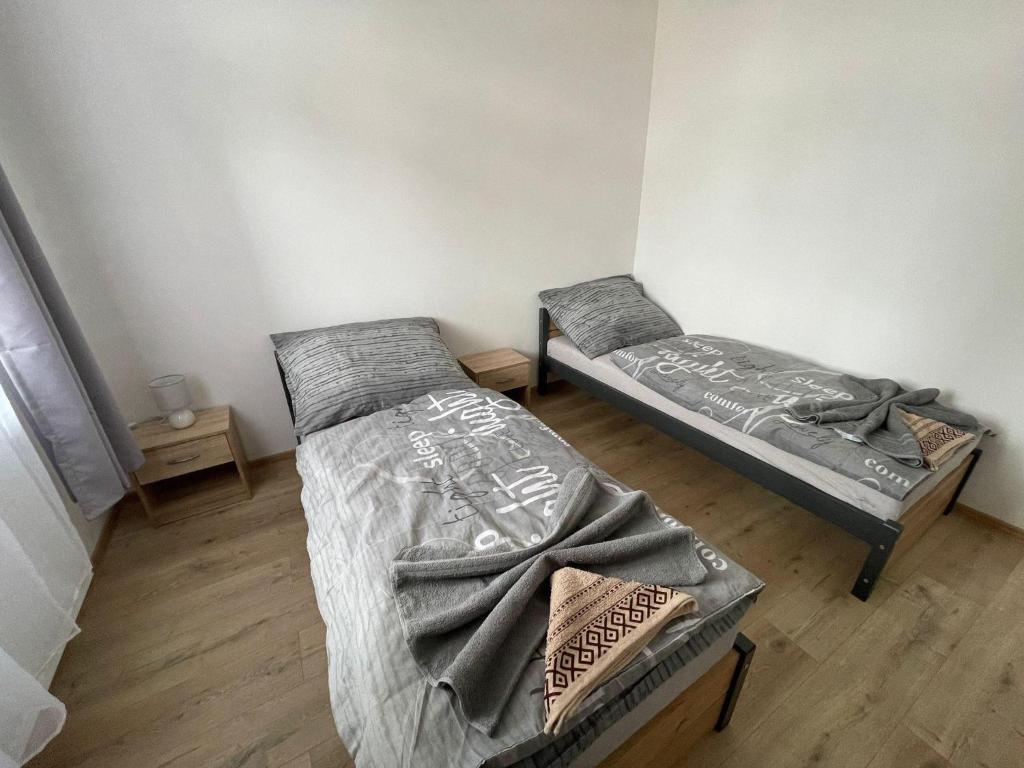 Postel nebo postele na pokoji v ubytování Apartmány Sport