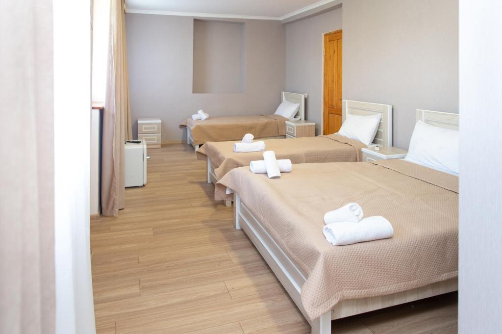 Postel nebo postele na pokoji v ubytování Hotel Veranda
