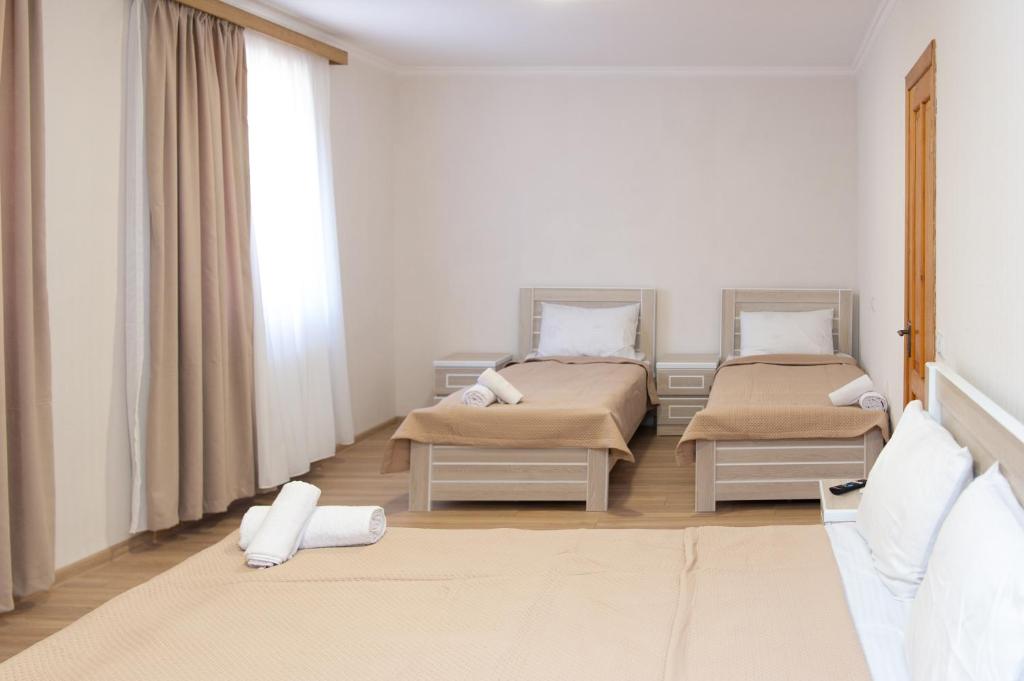 Postel nebo postele na pokoji v ubytování Hotel Veranda