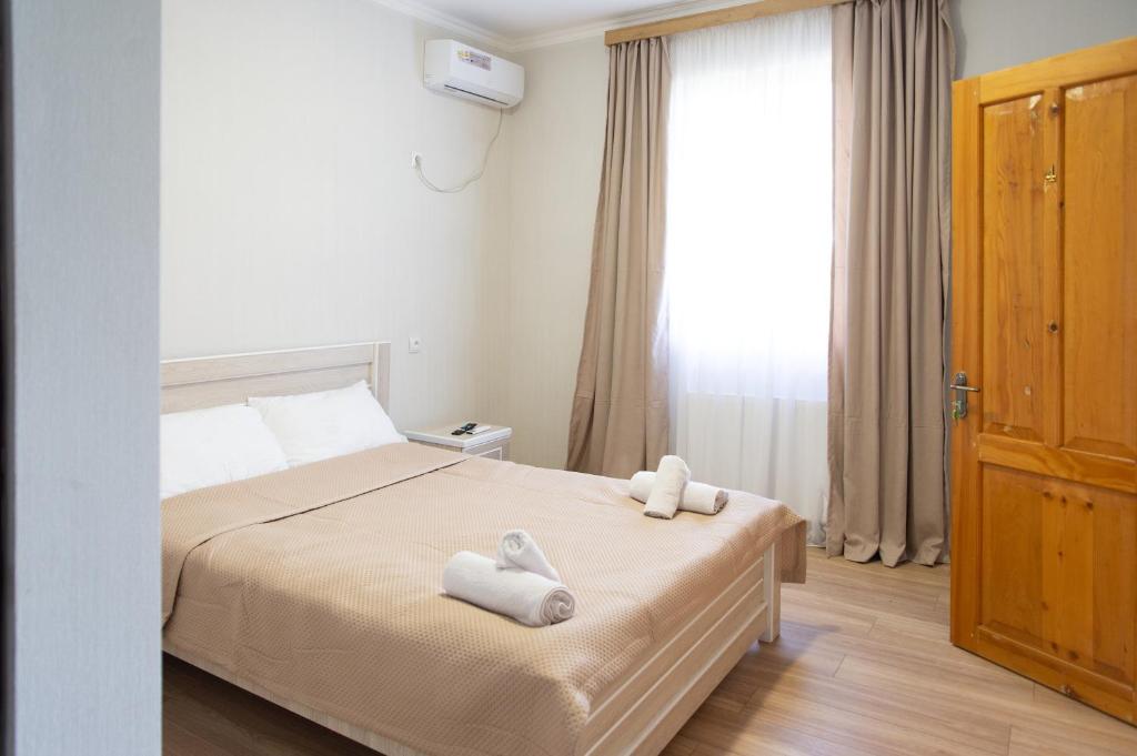 Postel nebo postele na pokoji v ubytování Hotel Veranda