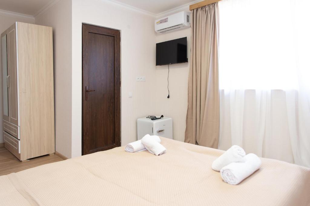 Postel nebo postele na pokoji v ubytování Hotel Veranda