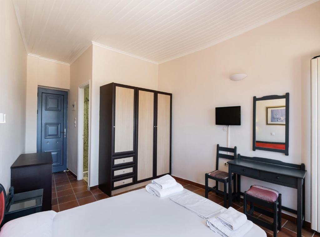 Postel nebo postele na pokoji v ubytování Ionio Hotel