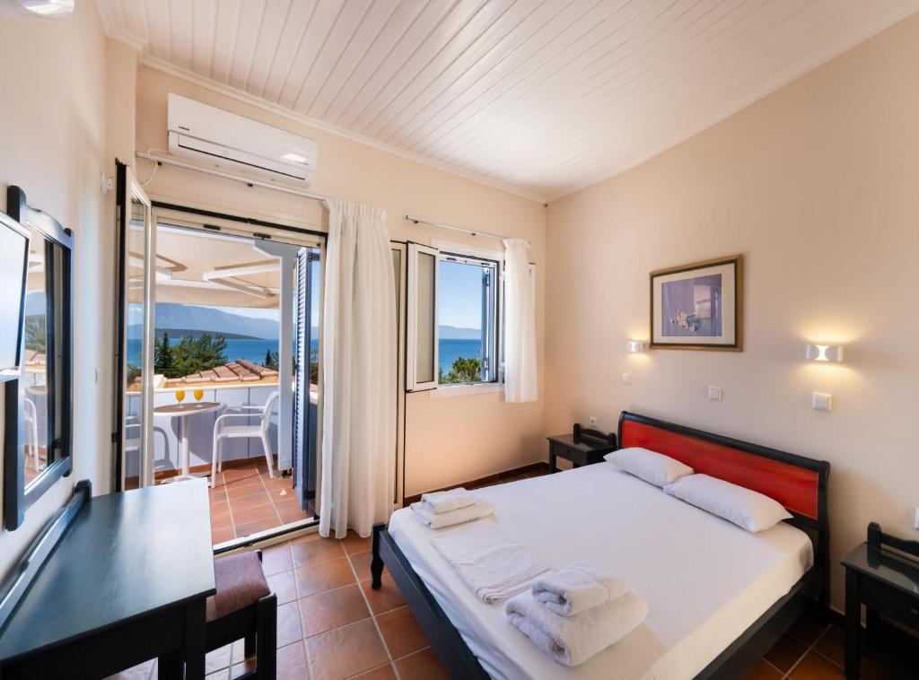 Postel nebo postele na pokoji v ubytování Ionio Hotel