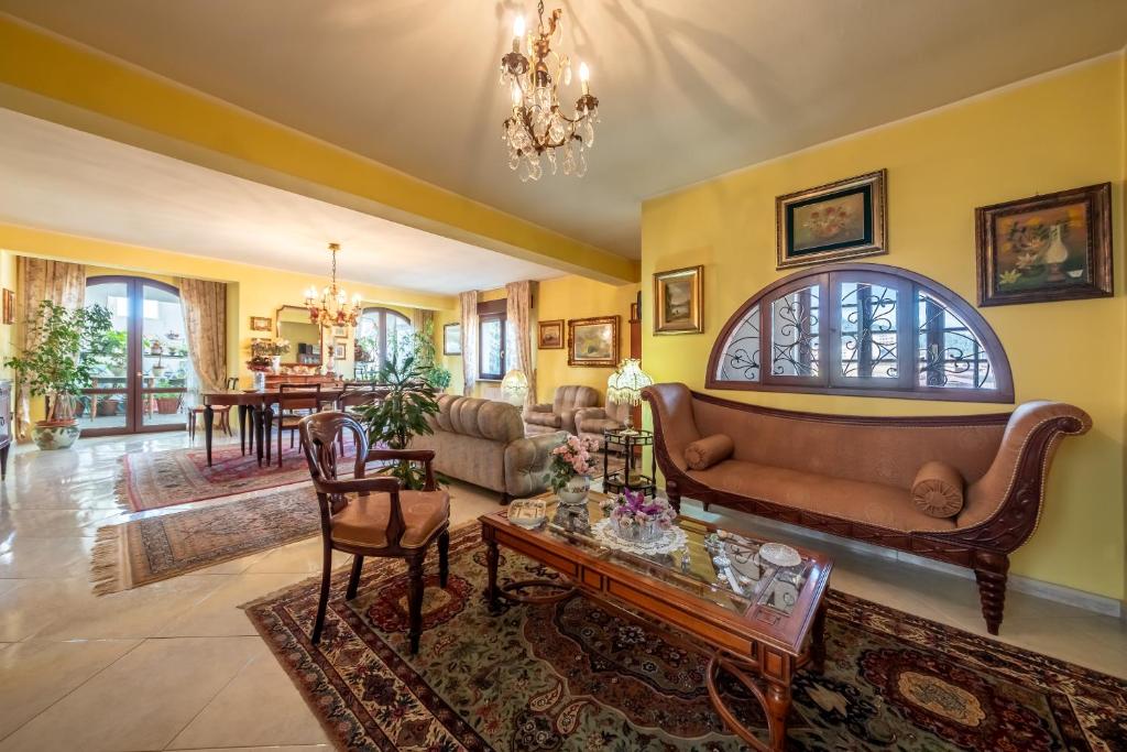 a living room with a couch and a table at Dolfi Grand Loft in Iglesias