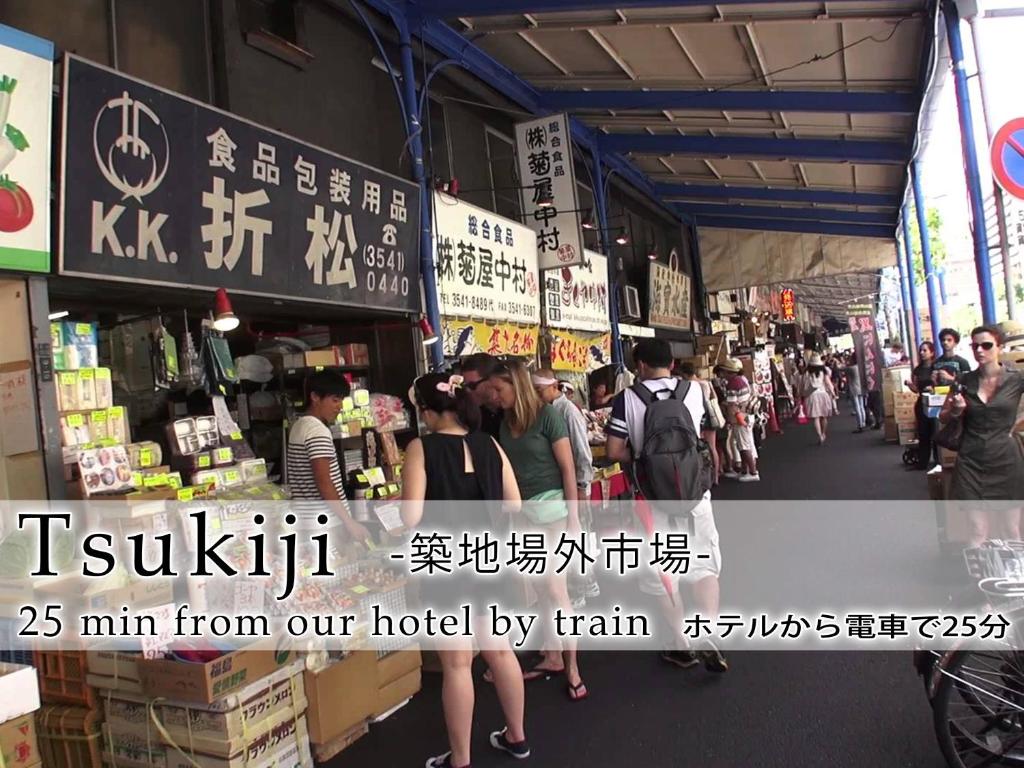 a group of people walking through a market at Hotel Abest Meguro in Tokyo