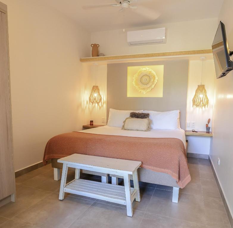 Postel nebo postele na pokoji v ubytování Les Voiles Blanches - Luxury Lodge