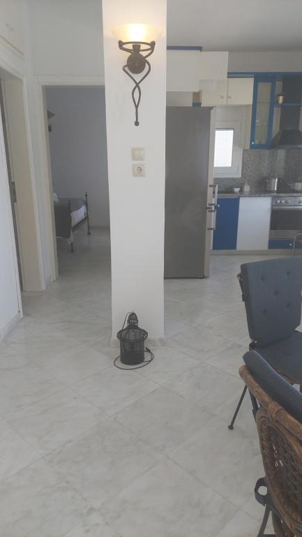 a room with a pillar with a light on it at Seaview dreams in Ormos Panagias