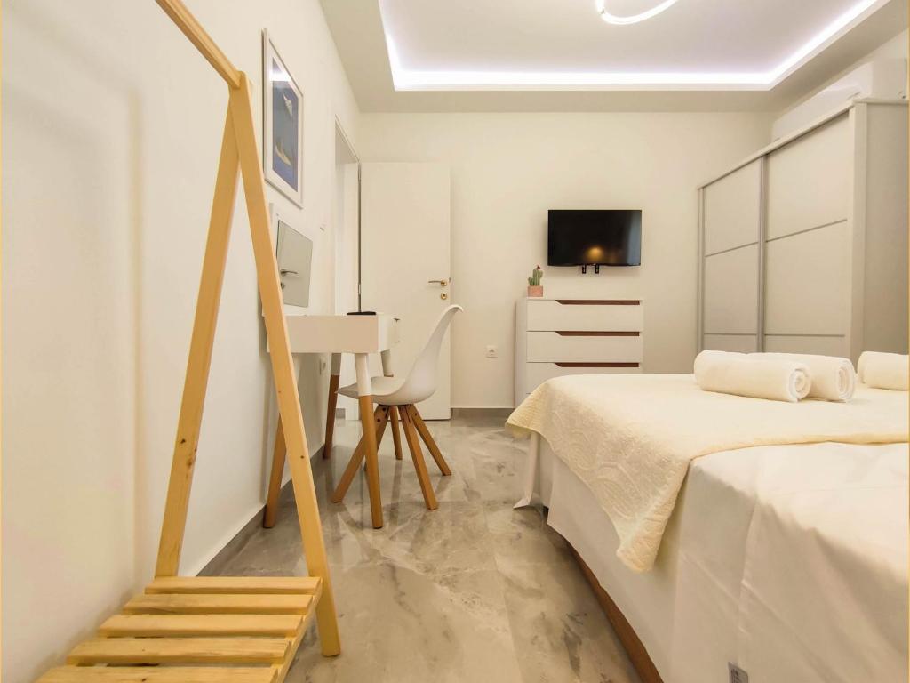 Postel nebo postele na pokoji v ubytování Zoé Suites