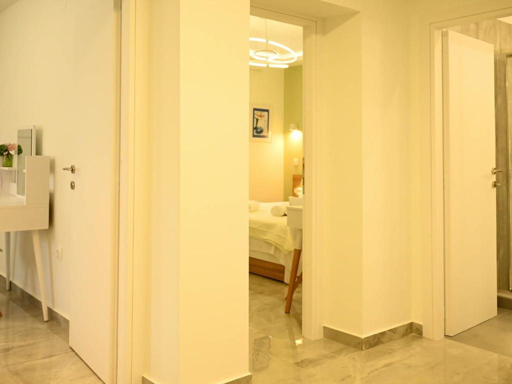 Postel nebo postele na pokoji v ubytování Zoé Suites