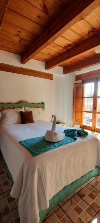 Postel nebo postele na pokoji v ubytování Hotel Tierra Maya