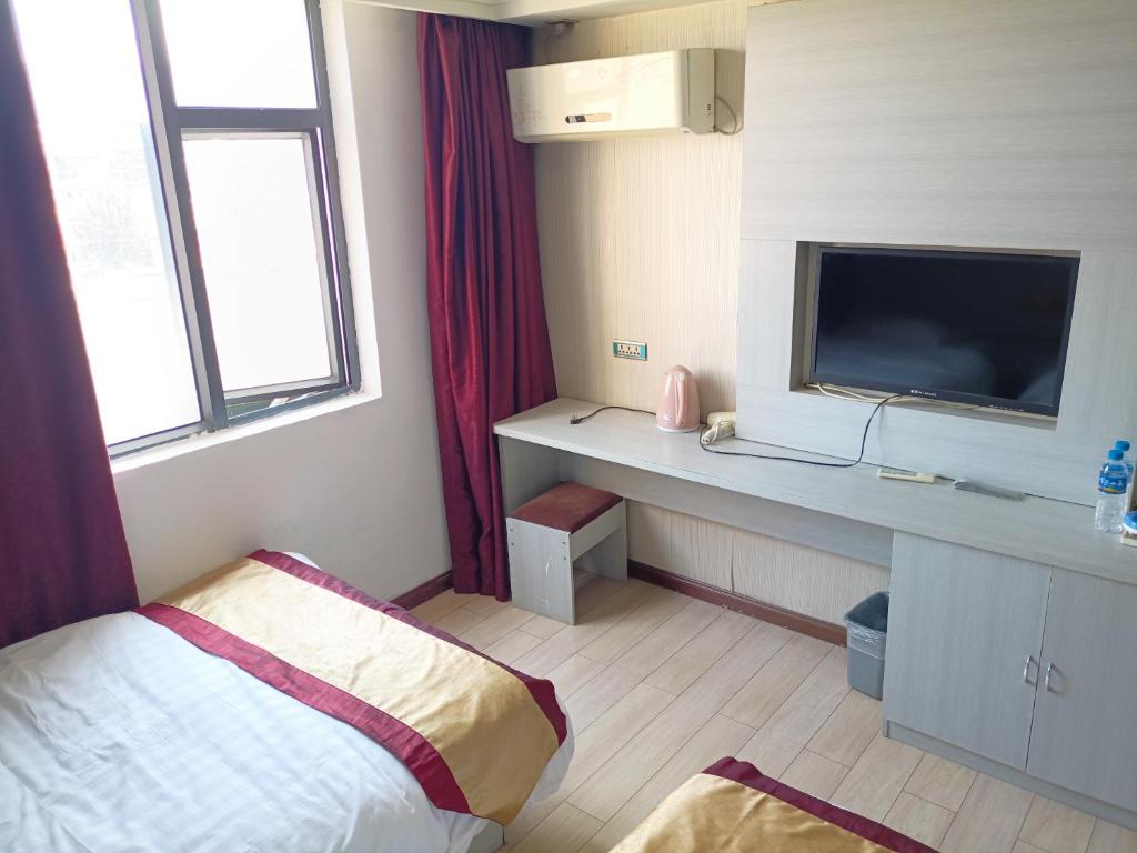 TV a/nebo společenská místnost v ubytování Juli Boutique Hotel