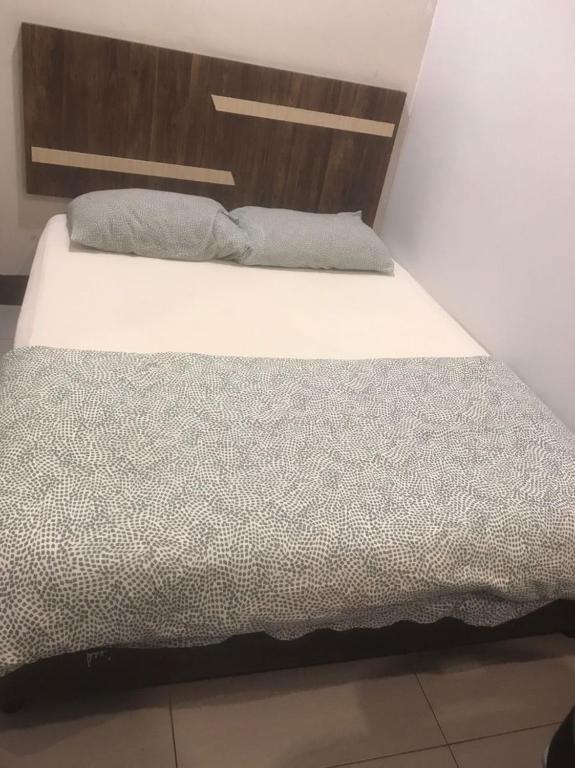 Postel nebo postele na pokoji v ubytování Ap Classic Hotel