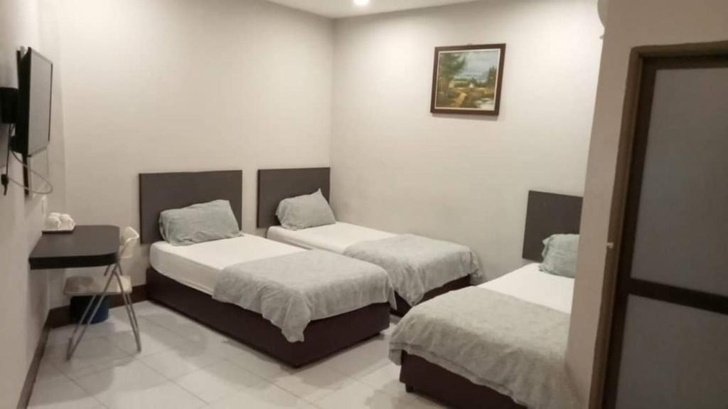 Postel nebo postele na pokoji v ubytování Ap Classic Hotel