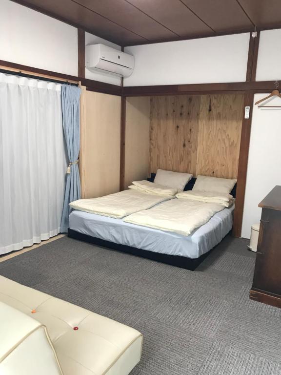 Postel nebo postele na pokoji v ubytování Guest House Ken-Ken