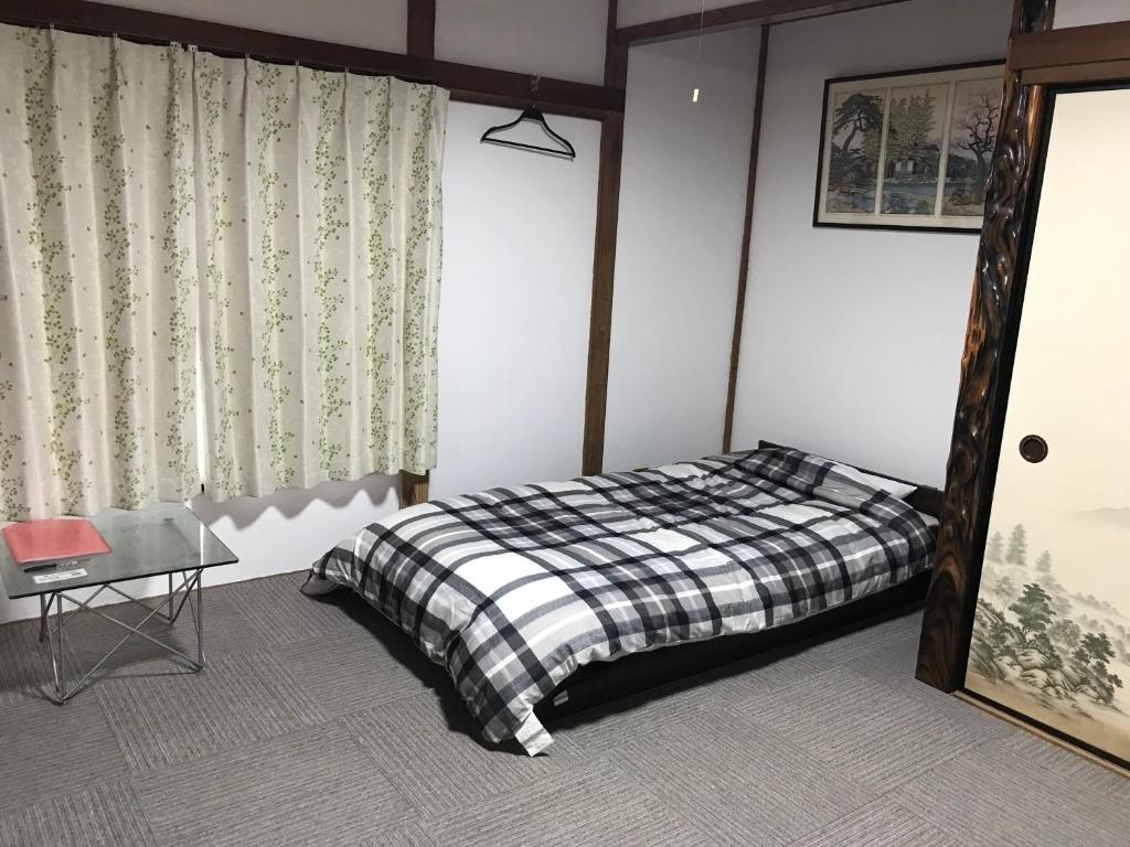 Postel nebo postele na pokoji v ubytování Guest House Ken-Ken