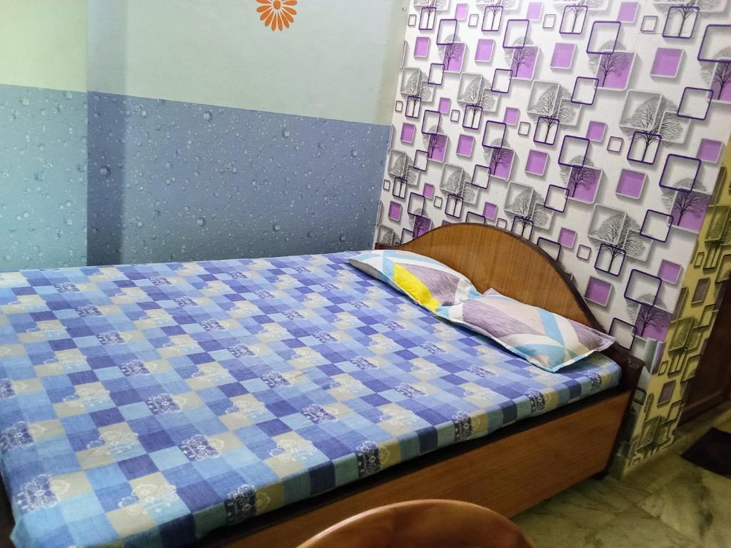 Postel nebo postele na pokoji v ubytování Amar priya guest house