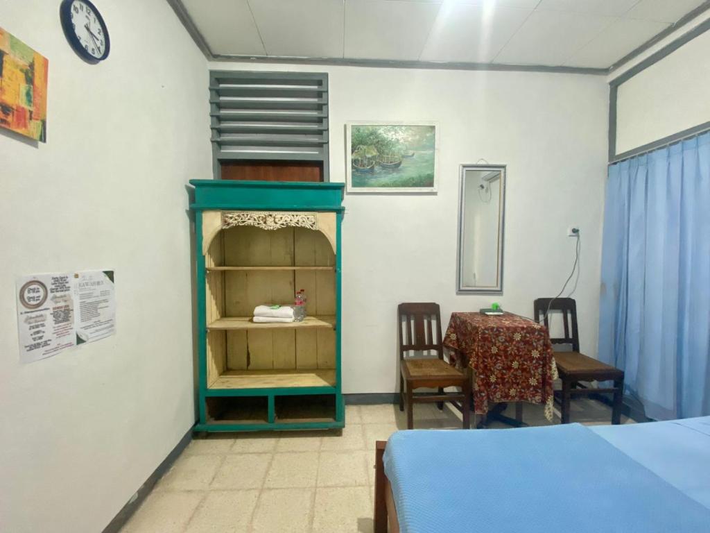 Postel nebo postele na pokoji v ubytování Backpacker Kawah Ijen