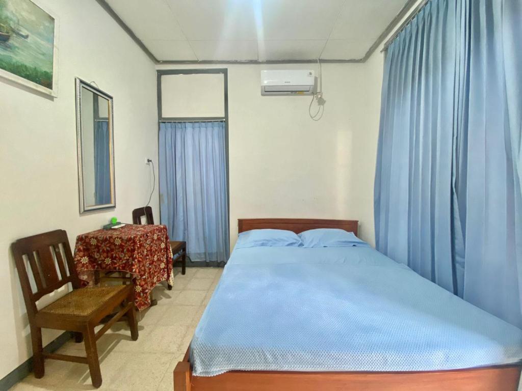 Postel nebo postele na pokoji v ubytování Backpacker Kawah Ijen