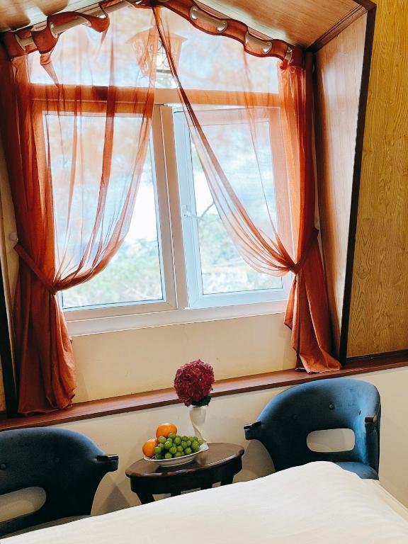 Postel nebo postele na pokoji v ubytování TTR Joy Apart' Hotel