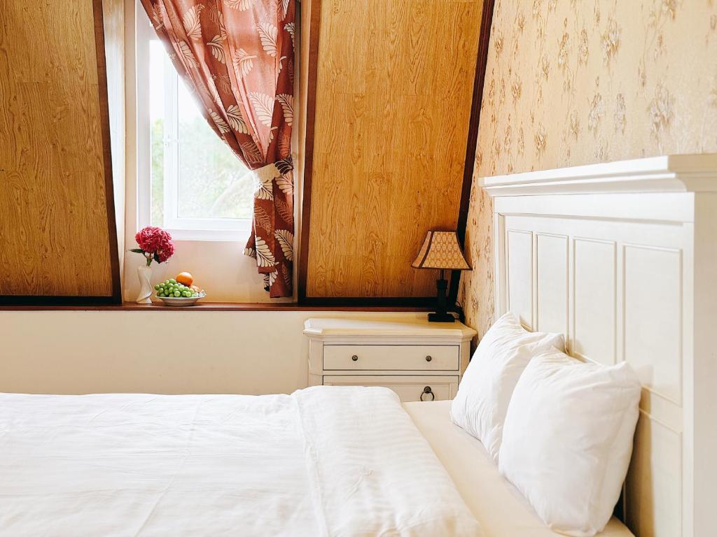 Postel nebo postele na pokoji v ubytování TTR Joy Apart' Hotel